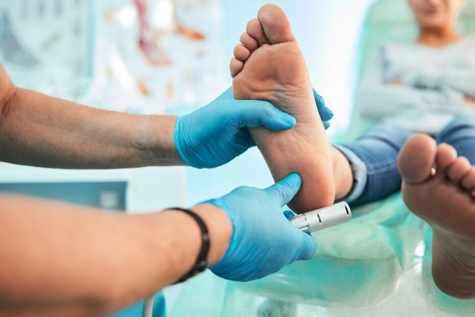 A podiatrist with a patient