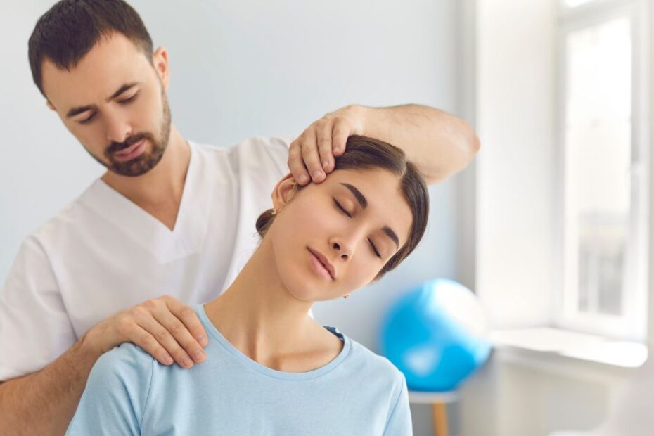 Chiropractor doing neck adjustment to a female