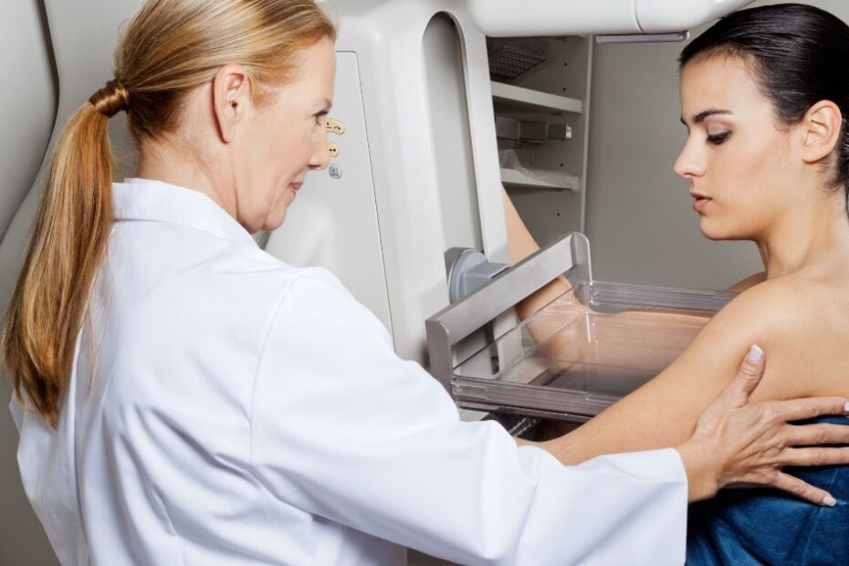 Doctor assisting patient during a mammogram