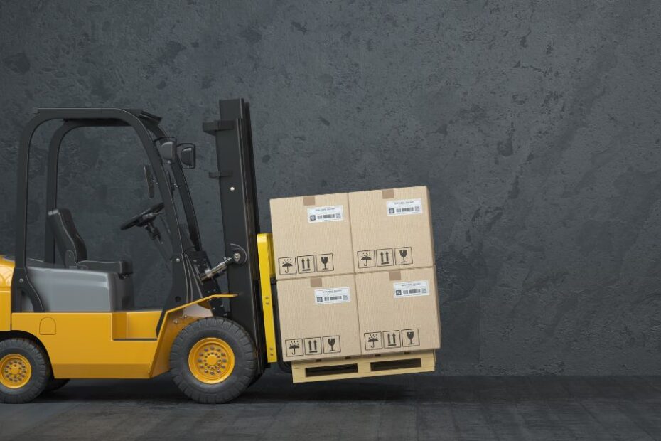 Forklift truck carrying boxes