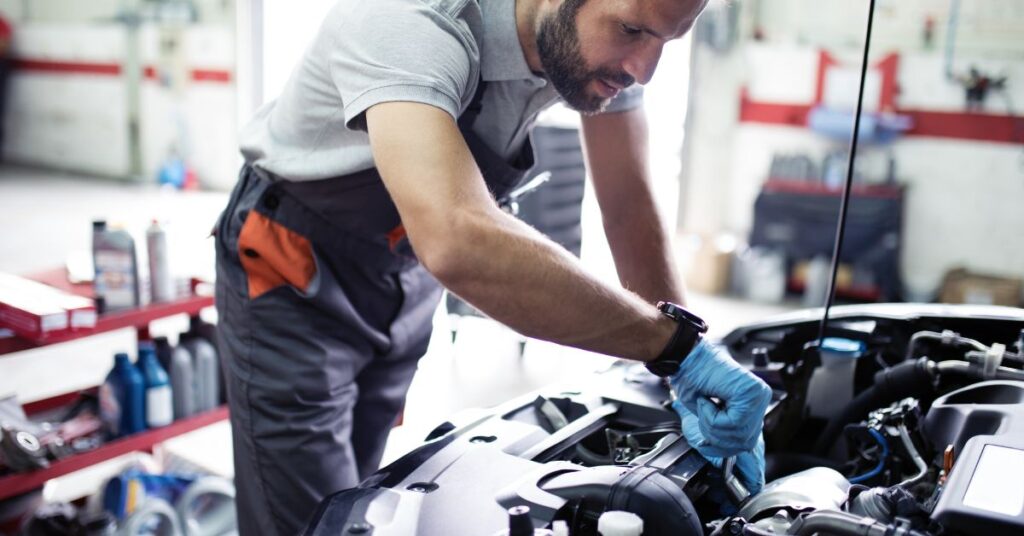 Mechanic performing car service