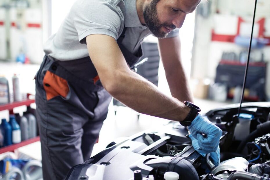 Mechanic performing car service