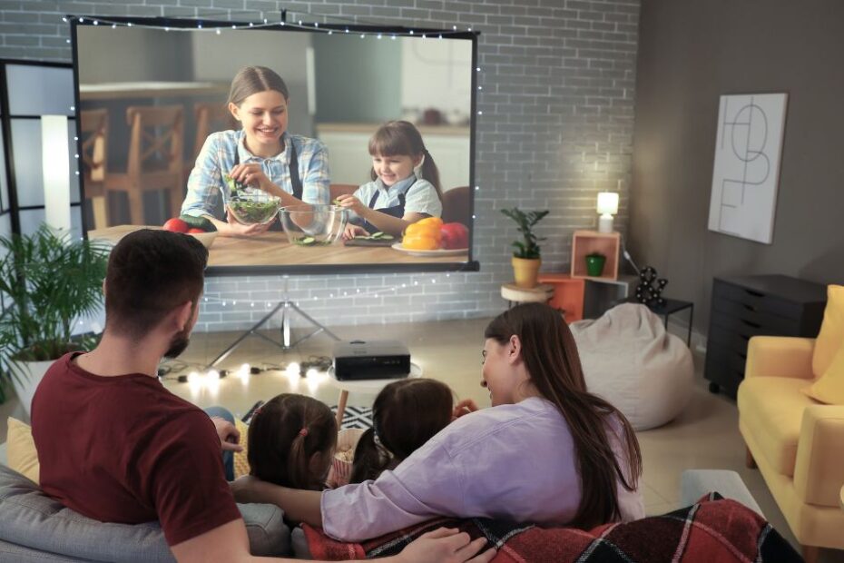 Young Family Watching Movie at Home