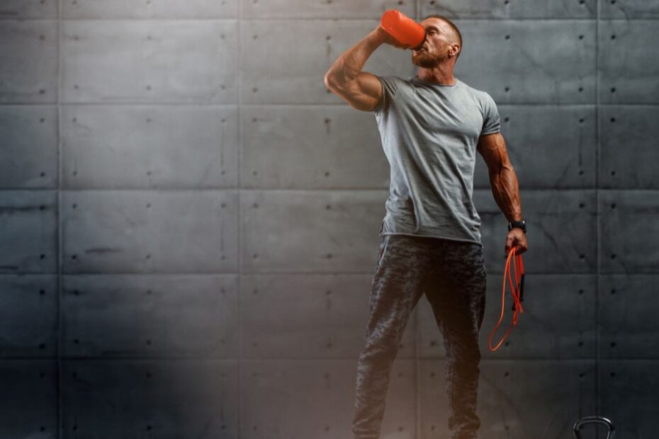 Muscular Men Drinks Protein After Workout