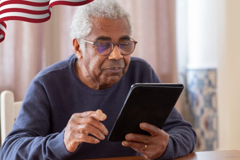 An Elderly Man in Black Sweater Using a Digital Tablet