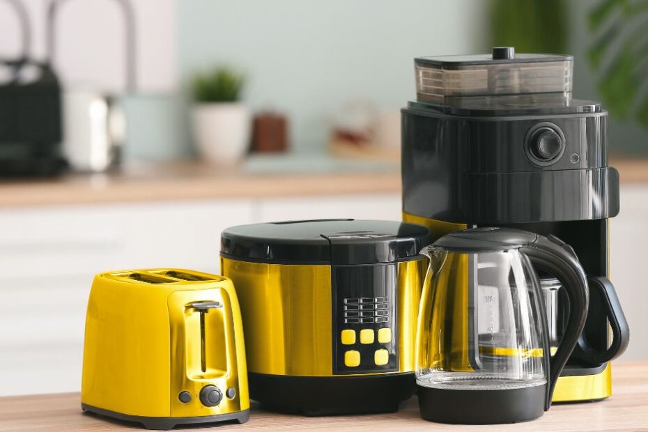 Different Household Appliances on Table in Kitchen