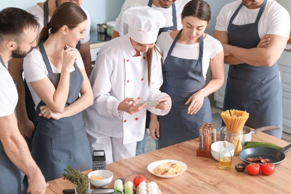 Female Chef and Students During Cooking Class