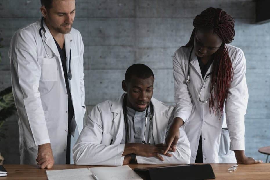 Doctors in discussion at a medical clinic, working on patient treatment plans.