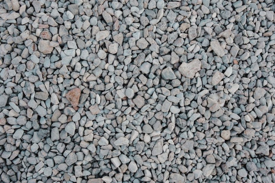 Detailed top view of a gravel stones background, ideal for construction use.