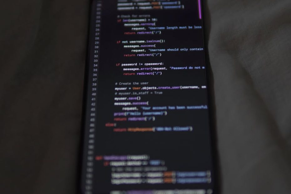 Close-up of a smartphone showing Python code on the display, showcasing coding and technology.
