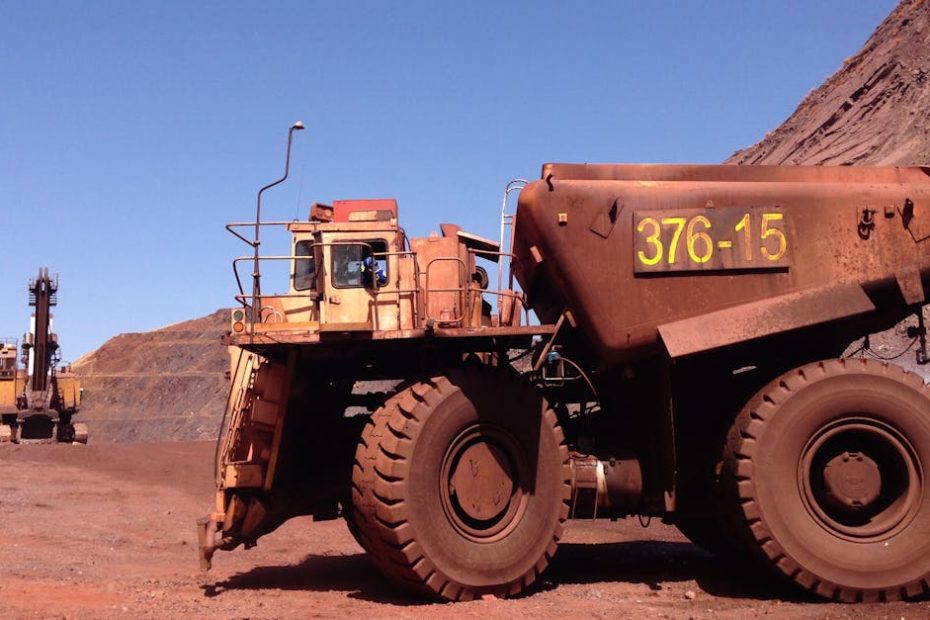 Large mining truck at a quarry in Thabazimbi, South Africa, under clear blue sky.