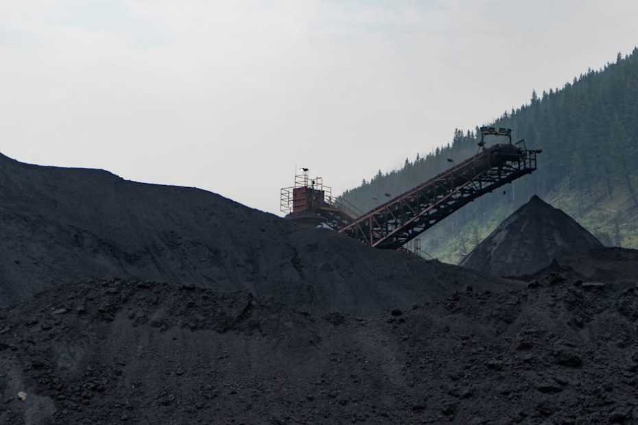 Industrial coal processing facility in Elkford, Canada with large coal piles.