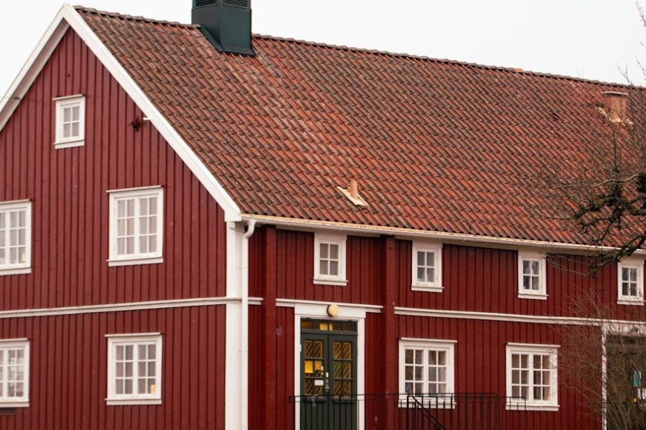 Charming red wooden house with classic Swedish architecture in Jönköping, Sweden.