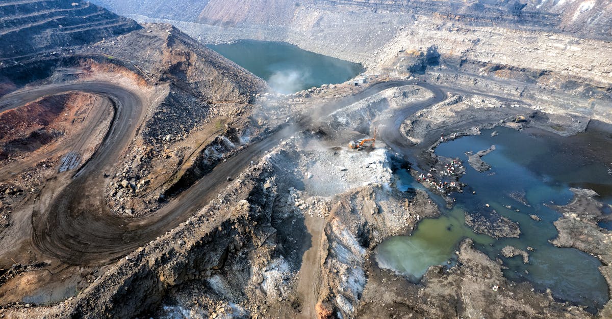 Expansive aerial shot of an active coal mine in Dhanbad, Jharkhand, India.