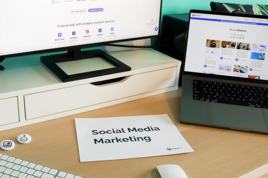 Stylish workspace with laptop and monitor for social media marketing.